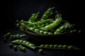 Green pea pods in a cup on a dark background. Royalty Free Stock Photo