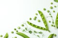 Green pea pods, seeds and twigs on white background Royalty Free Stock Photo