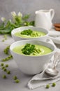 Green pea soup in bowls on grey concrete or stone background Royalty Free Stock Photo