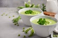 Green pea soup in bowls on grey concrete or stone background Royalty Free Stock Photo