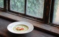 Green pea soup with bread and cheese on top Royalty Free Stock Photo