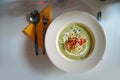 Green pea soup with bread and cheese on top Royalty Free Stock Photo