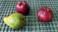 Green pear and two red apples Royalty Free Stock Photo