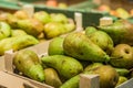 Green pears boxes shelves market on sale Royalty Free Stock Photo