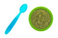 Green peas baby food mush in a bowl with spoon Royalty Free Stock Photo