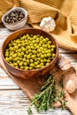 Green peas in a bowl. Canned food. White background. Top view Royalty Free Stock Photo