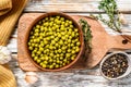 Green peas in a bowl. Canned food. White background. Top view Royalty Free Stock Photo