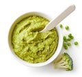 Green peas and broccoli baby puree on white Royalty Free Stock Photo