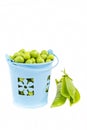 Green peas in a bucket Royalty Free Stock Photo