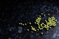 green peas on dark stone surface Royalty Free Stock Photo