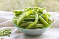 Green peas. Hulk pods in a glass bowl