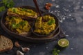 Green peas hummus sandwiches on a dark dish, copy space. Healthy Royalty Free Stock Photo