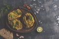 Green peas hummus sandwiches on a dark dish, top view, copy space. Healthy vegetarian food concept. Royalty Free Stock Photo