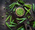 Green peas and pea pods on wooden table. Top view Royalty Free Stock Photo