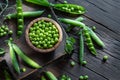 Green peas and pea pods on wooden table. Top view Royalty Free Stock Photo