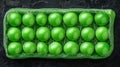 Green peas in a rectangular container Royalty Free Stock Photo