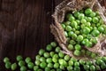 Green peas on wooden background