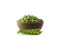 Green peas on a wooden bowl isolated on a white background. Vegetables with copy space for text. Green peas isolated on white. Royalty Free Stock Photo