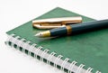 The green pen and notebook Royalty Free Stock Photo