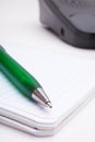 The green pen and notebook Royalty Free Stock Photo