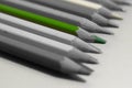 Green pencil on a background of colorless close-up.