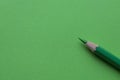 Green pencil on green paper Royalty Free Stock Photo
