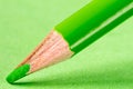 Green pencil on paper close-up Royalty Free Stock Photo