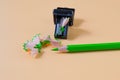 Green pencil tip shavings from sharpener Royalty Free Stock Photo