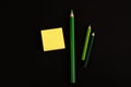 Green pencils and yellow blank sticky note paper Royalty Free Stock Photo