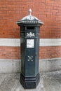 Green Penfold pillar box at Windsor and Eton Central Station Royalty Free Stock Photo