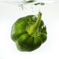 Green Pepper dropped into water Royalty Free Stock Photo