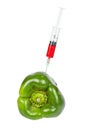 Green pepper with syringe inserted Royalty Free Stock Photo