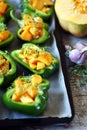 Green peppers stuffed with pumpkin. Selective focus. Macro.