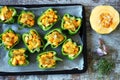 Green peppers stuffed with pumpkin. Selective focus. Macro.