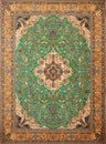 Green Persian carpet with antique pattern on the floor top view Royalty Free Stock Photo