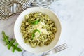 Green pesto risotto with parmisan, white background Royalty Free Stock Photo