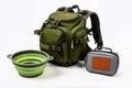 Green pet backpack with collapsible bowl and food container. Royalty Free Stock Photo