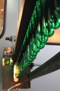 Green pet plastic bottle preforms on the conveyer. Concept of bottled mineral water production