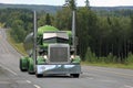 Green Peterbilt 359 Tank Truck on Scenic Highway