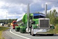 Green Peterbilt 359 in Truck Convoy