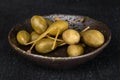 Green pickled caper on grey stone Royalty Free Stock Photo