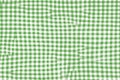 Green picnic blanket fabric with squared patterns and texture