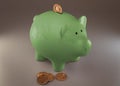 Green piggy bank with cryptocurrencies, golden physical coins, Ripple, Zcoin, Bitcoin and Etherium. Mining cryptocurrency