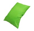 Green pillow at hotel or resort room isolated on white background with clipping path. Concept of confortable and happy sleep in