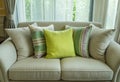 Green pillows on modern sofa