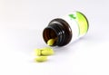 Green pills an pill bottle Royalty Free Stock Photo