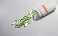 green pills on a table and red rubber stamp approved on the bottle Royalty Free Stock Photo