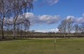 The Green and Pin Marker at Hole 1 of the Glens Course at Letham Grange Golf Club in Colliston. Royalty Free Stock Photo