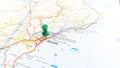 A green pin stuck in Alicante on a map of Spain