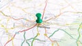 A green pin stuck in Angouleme on a map of France